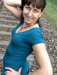 Juiciest mature prostitute is posing seminaked at home