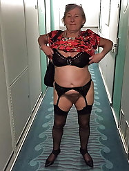 Old mistress is taking off her bra