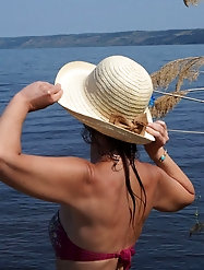 A gallery of women showcasing their legs on a wooden stage