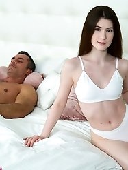A small girl orally pleasures and has sexual intercourse with two very large penises